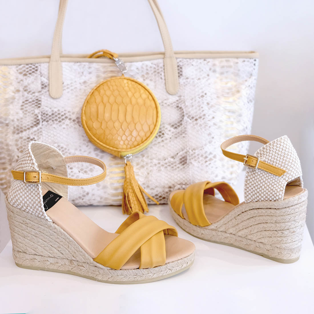 beautiful espadrille wedges in mustard yellow nappa leather and ankle slings in the same leather and handbags in natural and yellow leather from suzette accessories